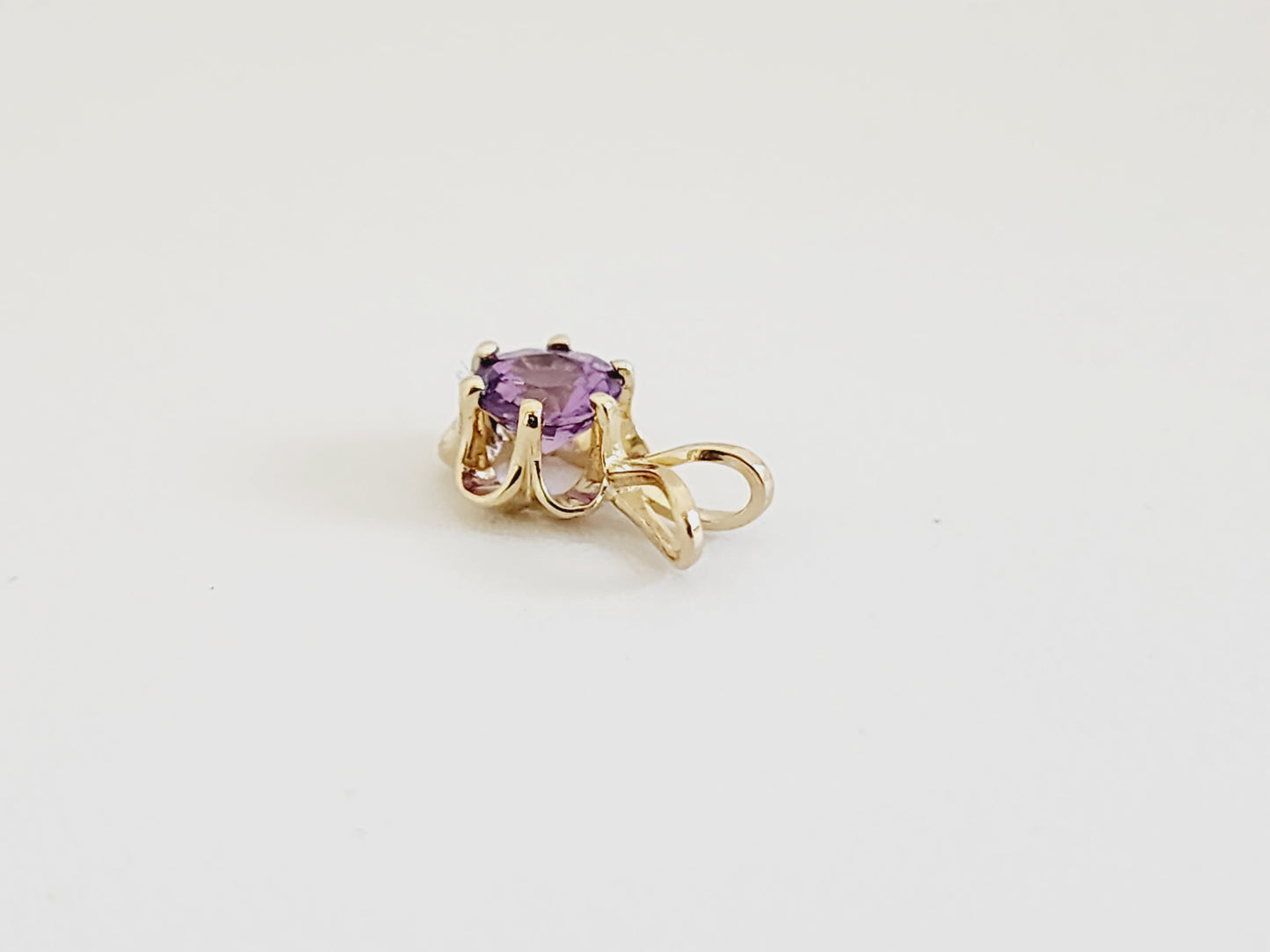 0.56 Carat Purple Sapphire Pendant 14 Karat Yellow Gold
